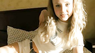 Teen long haired honey is looking extremely enchanting on her bed